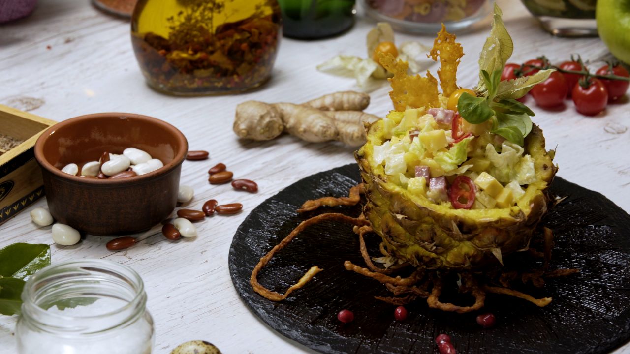 Tropical salad in pineapple basket