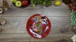 Apple pancakes with berry sauce